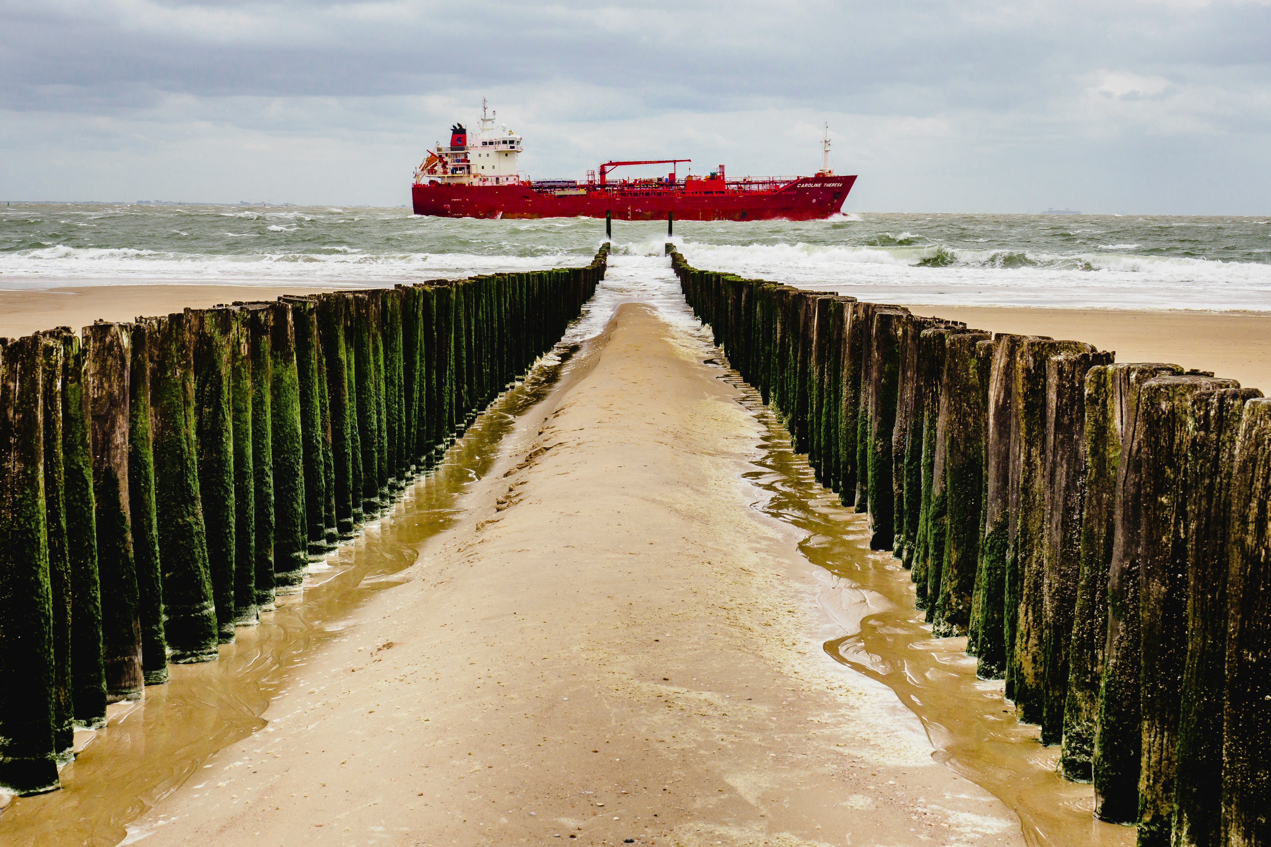 brown wooden dock on sea during daytime